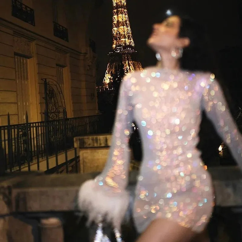 VESTITO IN RETE CON PIUME